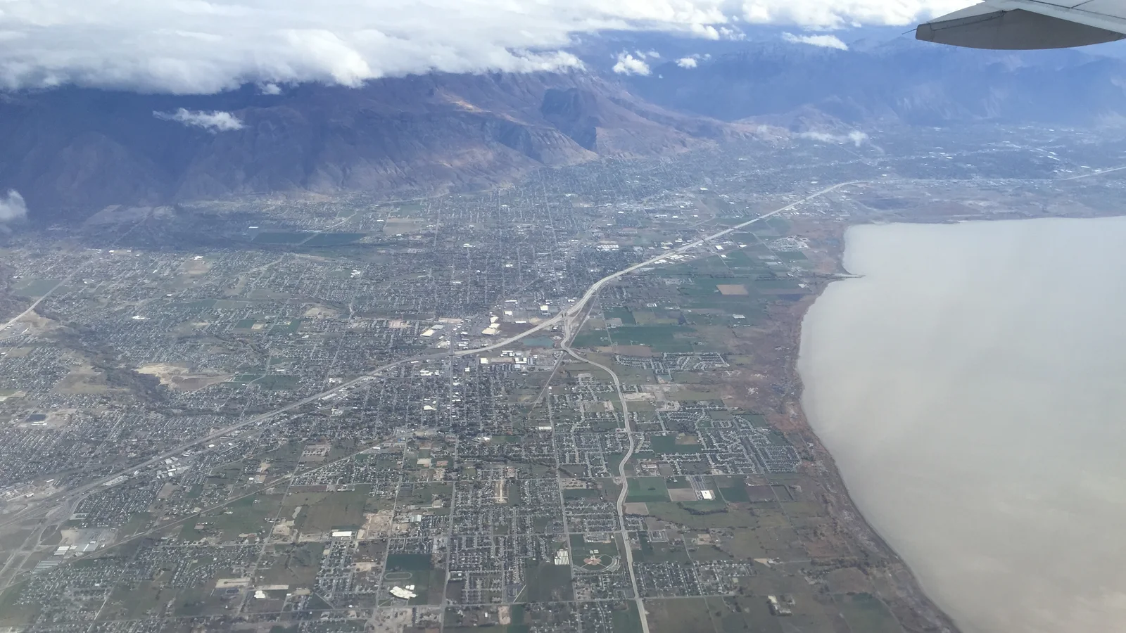 2015-11-03 10 16 13 View from an airplane of the cities of Lehi, American Fork, Pleasant Grove, Lindon and Orem, Utah along Interstate 15 and the northeast shore of Utah Lake.jpg